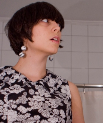self-portrait in the bathroom - mod 1960s black and white dress and earrings